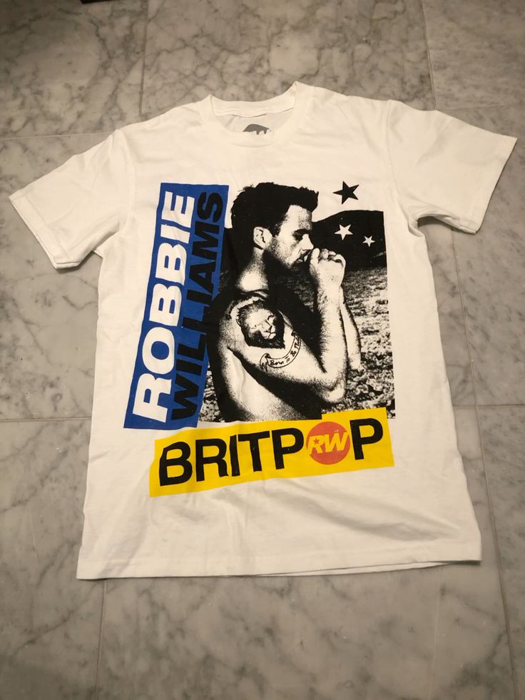 🖤🔥 CAMISETA ROBBIE WILLIAMS – EL ESTILO DE UNA LEYENDA 🎤✨